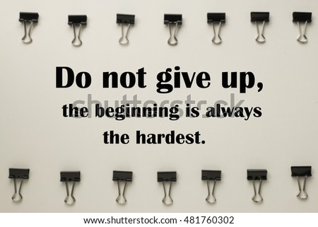Inspirational quote "Do not give up,the beginning is always the hardest" on blurred background 