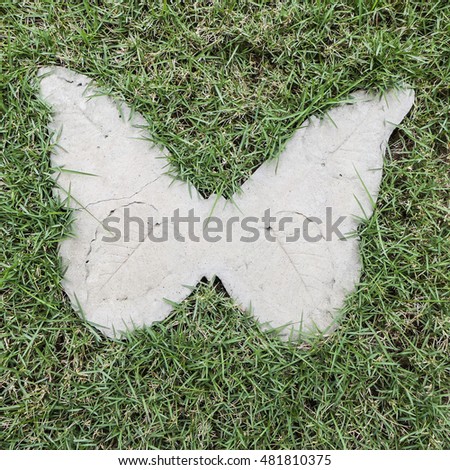 Ornamental cast concrete slabs with animal shapes are popular with home garden as decoration and stepping stone / Object background / It help to prevent damage to carpet grass from human walking on it