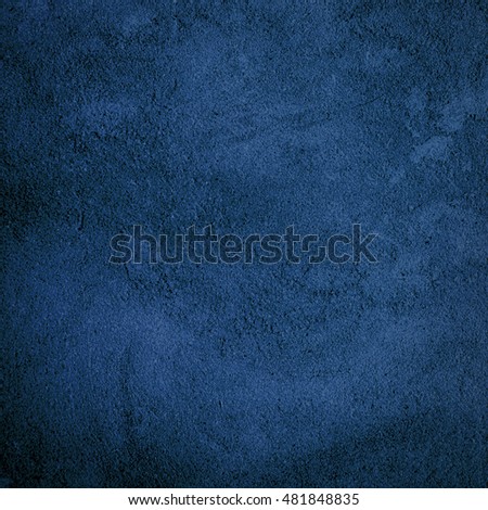 Abstract grunge navy blue background with bright center spotlight and dark vignette border frame. Square image