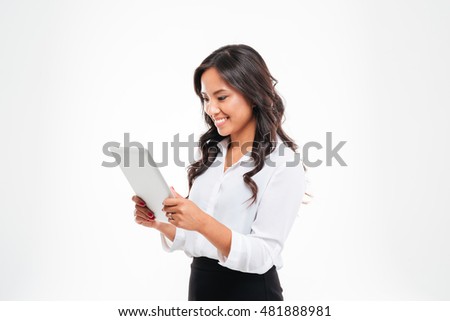 Beautiful happy asian businesswoman using tablet computer isolated on a white background