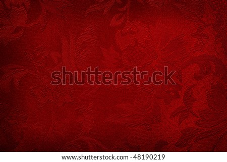 Red embroidered damask silk fabric, makes a rich background.