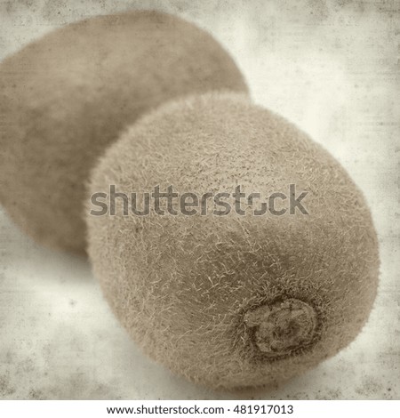 textured old paper background with fresh green kiwifruit