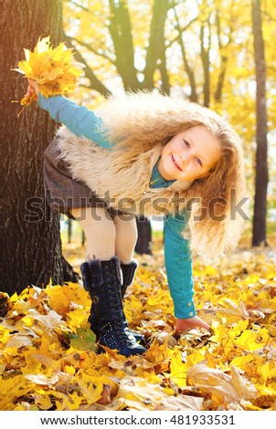 Beautiful Girl with Red Curly Hair in the Autumn Park - Sunny Day - Autumn Fall