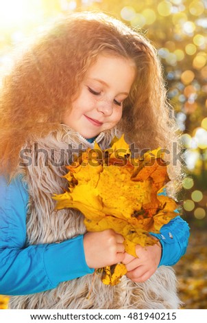 Beautiful Girl with Red Curly Hair in the Autumn Park - Sunny Day - Autumn Fall