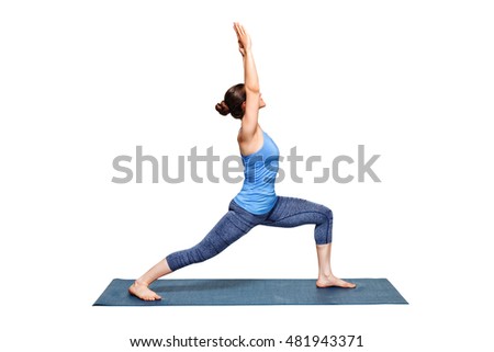 Beautiful sporty fit woman practices Ashtanga Vinyasa Yoga asana Virabhadrasana 1 - warrior pose 1 isolated on white Royalty-Free Stock Photo #481943371