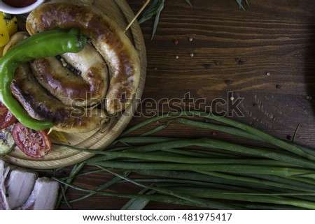 Wooden table with food. Top view. Meat, bacon and vegetables