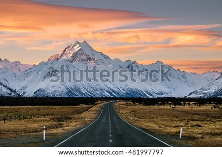 View of the majestic Aoraki Mount Cook with the road leading to Mount Cook Village. Taken during winter in New Zealand. Royalty-Free Stock Photo #481997797