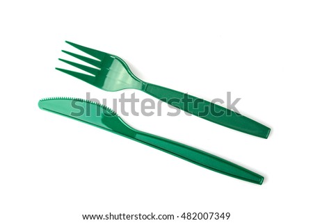 Green plastic knife and fork isolated on white Royalty-Free Stock Photo #482007349