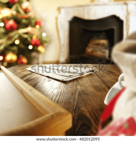 interior of home with xmas tree and fireplace with wooden table place for your decoration 