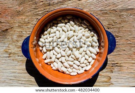 Beans in a bowl on wooden table