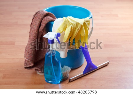 cleaning products on wooden floor