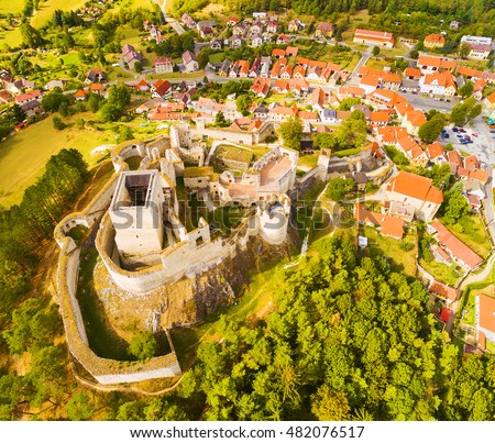Aerial view of ancient ruins (gothic castle Rabi) and medieval town Rabi in Southwest Bohemia. A discovery landmarks from drone. Czech Republic, Europe.
