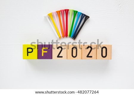 P.F.2020  - an inscription from children's wooden blocks and golf tees - Flat Lay Photography
