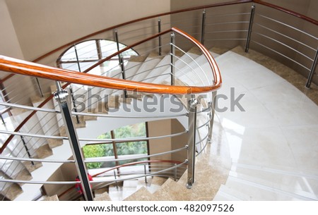 A marble, spiral staircase in the fashionable hotel.
