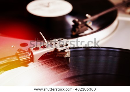 DJ turntables vinyl record player,analog audio technology for disc jockey playing music.Musical turn table technology for concert,party dj.Classic retro turn table audio equipment Royalty-Free Stock Photo #482105383