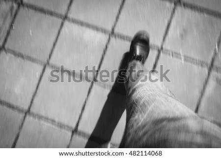 Motion blur of walking on the sidewalk. black and white image.
