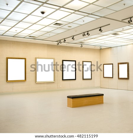 Gallery interior with empty frame on wall 