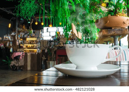 Coffee cup and tea On a wooden table in coffee shop - LOFT style
