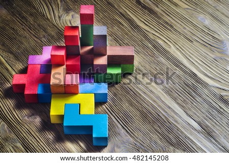 Abstract construction from wooden blocks with copy space. The concept of logical thinking, geometric shapes. Royalty-Free Stock Photo #482145208