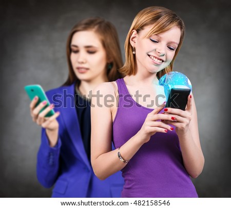Women looking on smartphone. Elements of this image furnished by NASA
