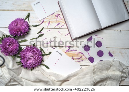 Word relax with book, cup of coffee and pink flowers. Copy space for text. greeting card
