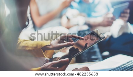 Closeup Young Woman Using Modern Tablet Hand.Hipster Making Great Business Idea.Coworker People Professional Gathered Together Decision Corporate Work.Startup Creative Presentation Concept Blurred.