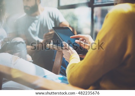 Closeup Young Woman Touch Modern Tablet Screen.Hipster Making Great Business Idea.Coworker People Professional Gathered Together Decision Corporate Work.Startup Creative Presentation Concept.Blurred