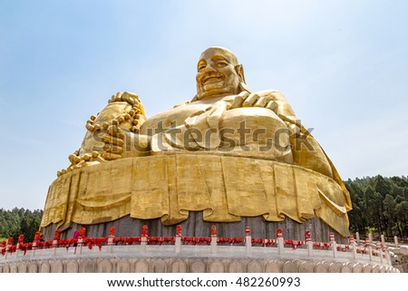 Big golden statue of Buddha in Qianfo Shan, also called mountain of the one thousand buddha, Jinan, Shandong Province, China Royalty-Free Stock Photo #482260993
