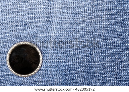Black buttons on denim