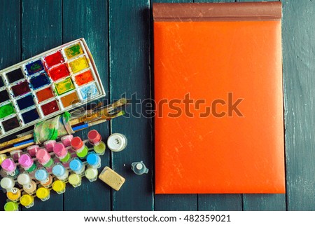 Set of watercolor paints and paintbrushes for painting 