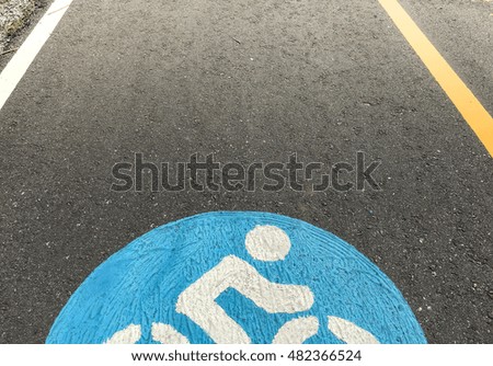 Bike lanes. Bike lane in suburb area with bike lane icon indicated. Bike lane sign on asphalt road. 