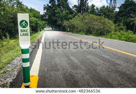 Bike lanes. Bike lane in suburb area with bike lane icon indicated. Bike lane sign 