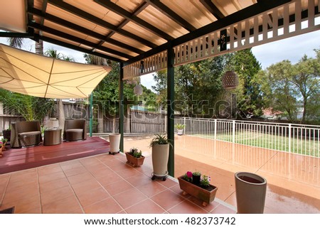 
back yard with outdoor seating and barbecue with family