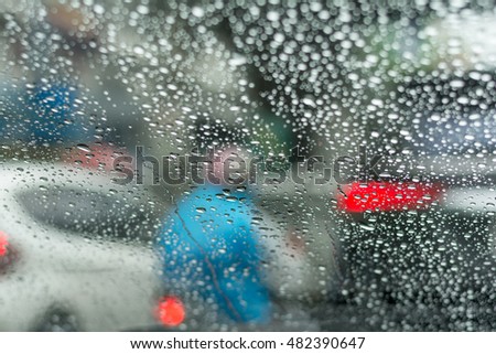 View from inside car while raining and traffic jams.