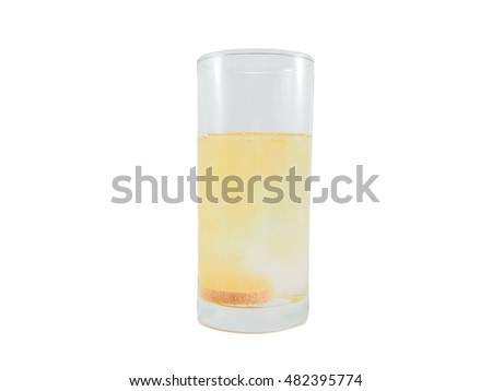 Orange flavor vitamin mineral supplement effervescent tablet dissolved in water of glass, isolated on white background.