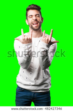 young man doing rock gesture