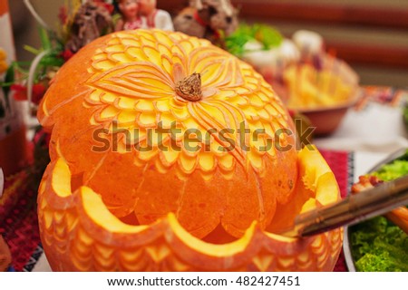 Orange, decoratively carved pumpkin. The concept of healthy food