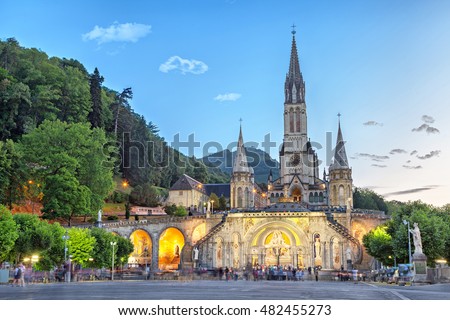 Rosary Basilica in the evening, Lourdes, Hautes-Pyrenees, France Royalty-Free Stock Photo #482455273