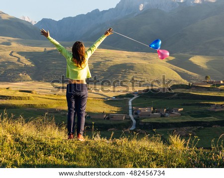 Woman enjoying view with balloons at evening scene-freedom concept-Happy woman on nature-vintage themes