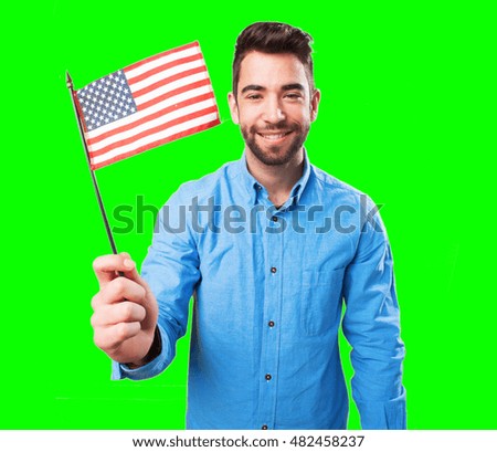 man holding a united states flag
