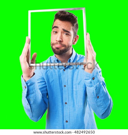 contradictory man holding a frame