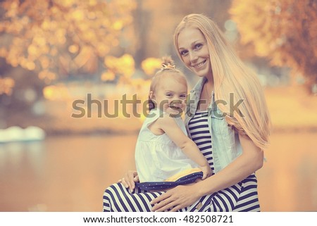 Mother hugging little daughter portrait