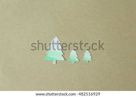 Christmas tree paper on brown.