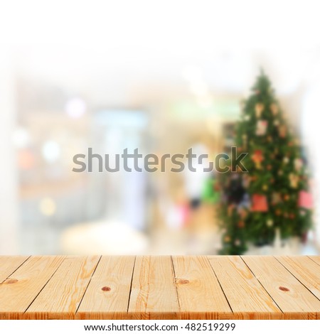 Wood table top on Blurred office decorated Christmas background - can be used for display or montage your products