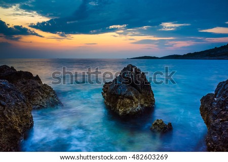 Seascape Razanj Croatia Europe. Beautiful nature and landscape photo of Adriatic Sea in Dalmatia. Calm warm summer evening at dusk after sunset. Colorful sky and ocean. Nice joyful peaceful picture.
