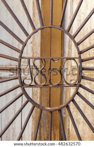Iron detail window with date 1850.