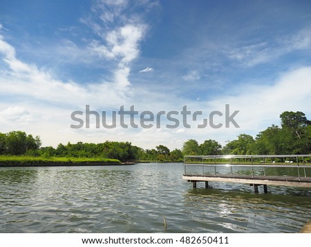 Stainless bridge in the lake with blue sky