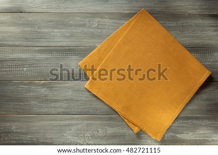 cloth napkin on wooden table background