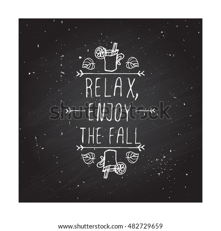 Hand-sketched typographic element with mulled wine, leaves and text on blackboard background. Relax enjoy the fall