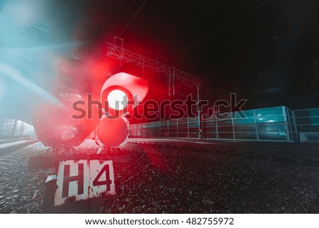 Red semaphore railway night. Photo on long exposure night